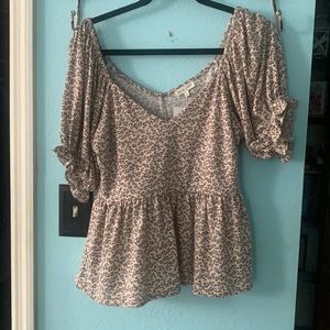 Leopard print ruffle shirt with bell sleeves.